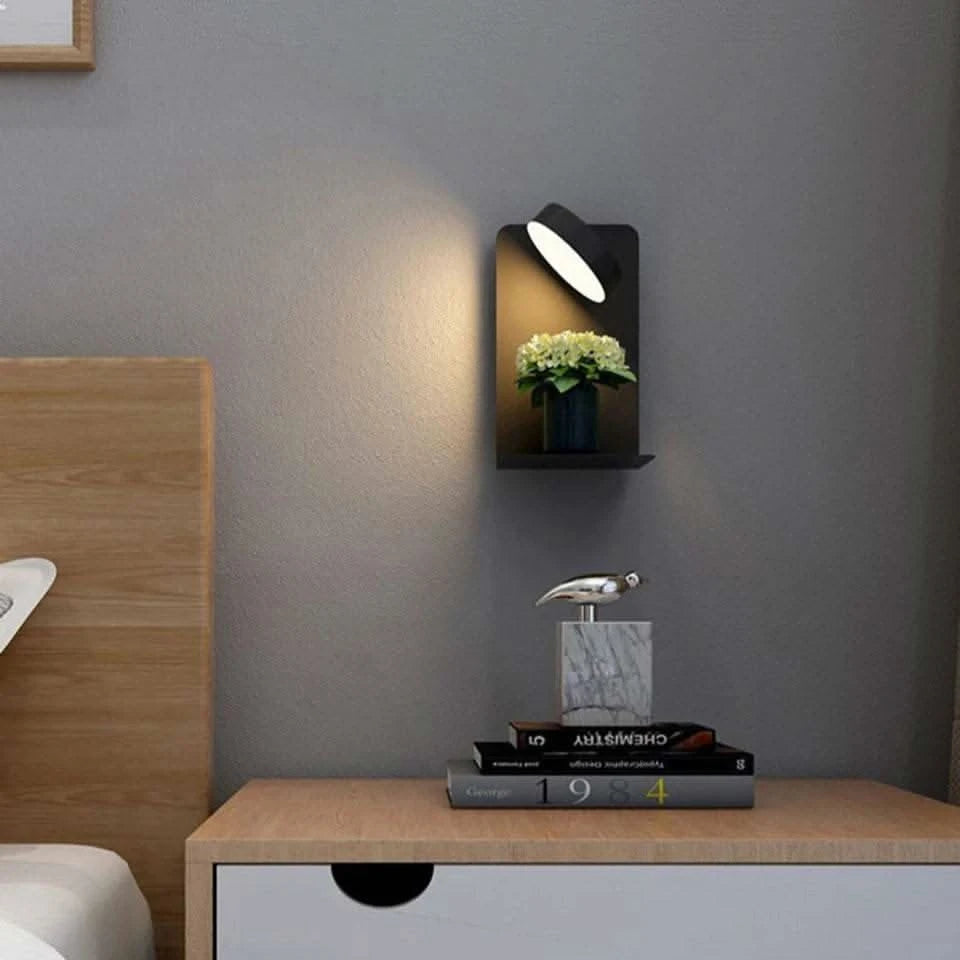 led lamp on wall - Futura's Studio charging phone beside bed